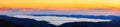 Picturesque sunrise morning in mountains above clouds, Carpathians, panoramic view, Ukraine. Royalty Free Stock Photo