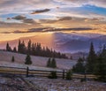 Picturesque sunset above late autumn mountain countryside. Ukraine, Carpathian Mountains. Peaceful traveling, seasonal, nature Royalty Free Stock Photo