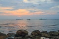 Picturesque sunset near the sea with ships, horizon and orange clouds. Phu Quoc, Vietnam. Royalty Free Stock Photo