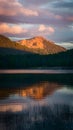 Picturesque sunset scene bathes the lake in warm, golden hues