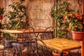 Picturesque tables and chairs in a narrow street in old town Sorrento Royalty Free Stock Photo