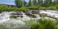 Picturesque threshold and dam with spillway on the Suenga River