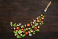 Picturesque top view composition of fresh healthy salad components on wooden table. Royalty Free Stock Photo