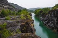 A picturesque and tranquil place with a calm river in a rocky gorge during a colorful summer. Rainy summer in a nature park Royalty Free Stock Photo