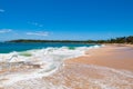 Picturesque tropical beach with sand and waves Royalty Free Stock Photo