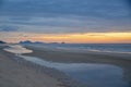 A picturesque tropical orange coloured cloudy coastal sunrise seascape in a blue sky. Thailand Royalty Free Stock Photo