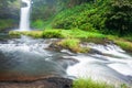 Picturesque tropical waterfall on rainy morning Royalty Free Stock Photo