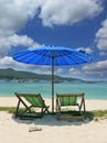 A picturesque umbrella and chaise lounges Royalty Free Stock Photo