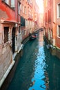 Picturesque view of ancient buildings, bridge and channel with gondolas in Venice, Italy. Beautiful romantic italian city