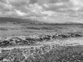 A picturesque view of the barges floating along the Black Sea in the background of the hills