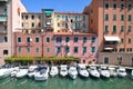 Picturesque view on boats in city channel in Livorno, Italy