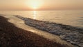 Picturesque view bright sunset on sandy beach. Soft sunlight illuminate ocean. Royalty Free Stock Photo