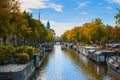 Picturesque view of the canal in a bright autumn day in Amsterdam, Netherlands