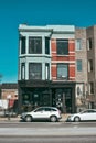 Picturesque view of a classic building in Chicago, IL, with a vibrant blue sky in the background