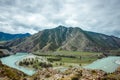 Picturesque view on the confluence of two mountain rivers. Katun river and Chuya river against of Altai mountains, Russia Royalty Free Stock Photo