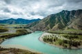 Picturesque view on the confluence of two mountain rivers. Katun river and Chuya river against of Altai mountains, Russia Royalty Free Stock Photo