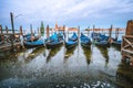 Picturesque view of Gondolas floating in the Grand Canal in evening warm light, San Giorgio Maggiore church in Royalty Free Stock Photo