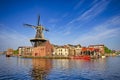 Picturesque View of Harlem Sight With De Adriaan Windmill on Spaarne River On The Background At Noon