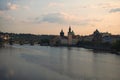 Picturesque view of the historical part of the city Prague during sunrise. Medieval Charles Bridge over Vltava River Royalty Free Stock Photo