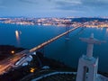 Illuminated Lisbon and 25th April Bridge Royalty Free Stock Photo