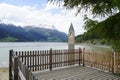 scenic view of lake Resia and sunken church steeple of Lago di Resia in Curon region (Vinschgau, South Tyrol, Italy) Royalty Free Stock Photo