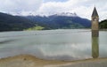 scenic view of lake Resia and sunken church steeple of Lago di Resia in Curon region (Vinschgau, South Tyrol, Italy) Royalty Free Stock Photo