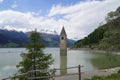 scenic view of lake Resia and sunken church steeple of Lago di Resia in Curon region (Vinschgau, South Tyrol, Italy) Royalty Free Stock Photo