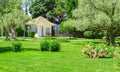 Picturesque view of the Mediterranean landscape with a beautiful lawn, a small farmhouse and olive and cypress trees Royalty Free Stock Photo