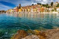 Menton. Antique multi-colored facades of medieval houses on the shore of the bay.