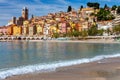 Menton. Antique multi-colored facades of medieval houses on the shore of the bay.