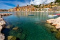 Menton. Antique multi-colored facades of medieval houses on the shore of the bay.