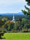 Old Church and steeple on a partly cloudy Fall day in Groton, Massachusetts, Middlesex County, United States. New England Fall. Royalty Free Stock Photo