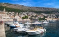 Picturesque view on the old town and port medieval Ragusa and Dalmatian Coast of Adriatic Sea, Dubrovnik, Croatia. Royalty Free Stock Photo
