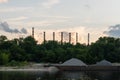 Yaroslavl region, Russia, July 8, 2023. Industrial zone with huge pipes on the river bank.