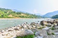 View of River Banks and Green Mountains in the Countryside of Nepal Royalty Free Stock Photo