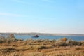 Picturesque view of river with tugboat and beautiful shore