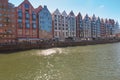 Picturesque view of the riverside with characteristic medieval Crane and historic buildings near the Motlawa river in the port.