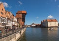 Picturesque view of the riverside with characteristic medieval Crane and historic buildings near the Motlawa river in the port.