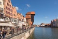 Picturesque view of the riverside with characteristic medieval Crane and historic buildings near the Motlawa river in the port.