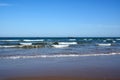 A picturesque view of the seascape from the beach. Two cargo ships float on the horizon in the distance Royalty Free Stock Photo