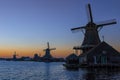 Picturesque View of traditional Dutch Windmills At Sunset During Golden Hour Royalty Free Stock Photo