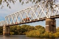 Picturesque view of a train traveling along a railway bridge over a river in Belarus Royalty Free Stock Photo