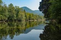 Picturesque view of the tranquil Kolpa river flowing through the lush forests.