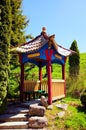 Picturesque view of wooden chinese style arbor in Zolochiv Castle. Beautiful suuny sprin day Royalty Free Stock Photo