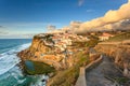 Picturesque village Azenhas do Mar. Holiday white houses on the edge of a cliff with a beach and swimming pool below. Landmark nea Royalty Free Stock Photo