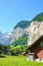 Picturesque village Lauterbrunnen in Switzerland with famous Staubbach Falls in background. One of Swiss major tourist attractions