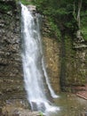 Picturesque waterfall in a mountain gorge. Manyava, Carpathians. Royalty Free Stock Photo