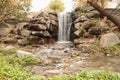 Picturesque waterfall and rocks.