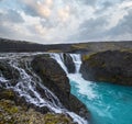 Picturesque waterfall Sigoldufoss autumn view. Season changing in southern Highlands of Iceland Royalty Free Stock Photo