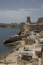 Picturesque waterfront scene of the surrounding buildings and boats in Valetta, Malta Royalty Free Stock Photo